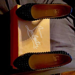 Black spiked Hardly worn Christian Loubutin pumps.